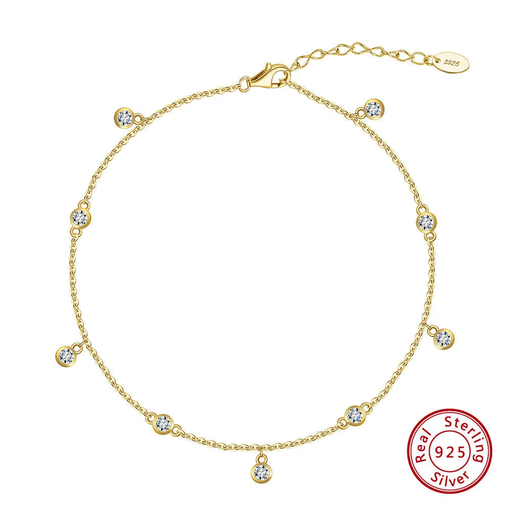 Women's sterling silver anklet with small geometric cubic zirconia pendant in gold or white gold finish.
