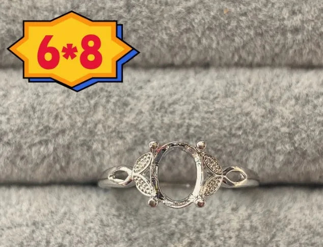 Oval denier open mouth ring with 6x8mm stone and five-pointed star on copper band.