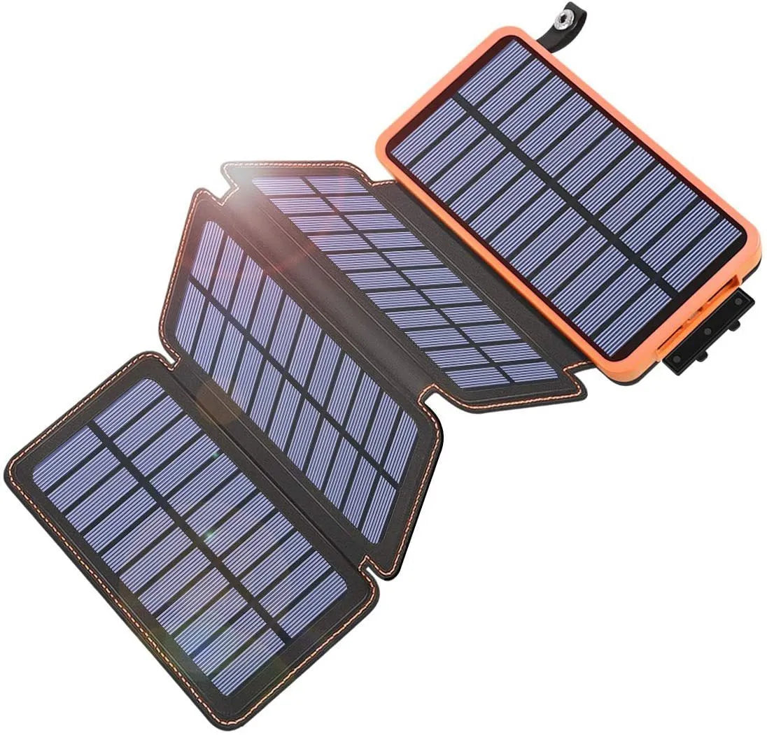 Outdoor rainproof solar phone charger with LED light in multiple colour options on a rustic surface.