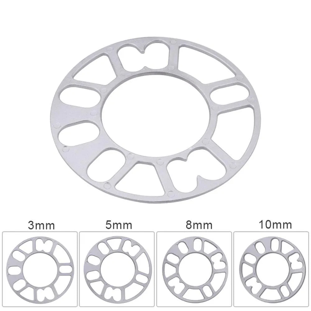 A single, circular metal automotive wheel hub spacer gasket for modifying wheel offset and brake clearance.