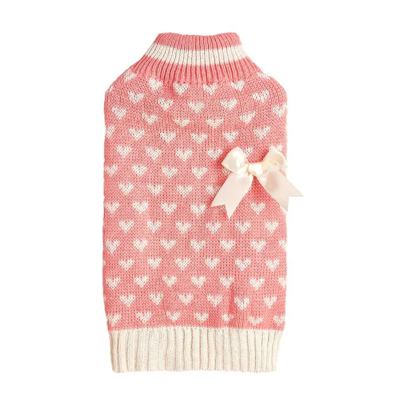 Red acrylic dog sweater with a large white love heart design on the back.