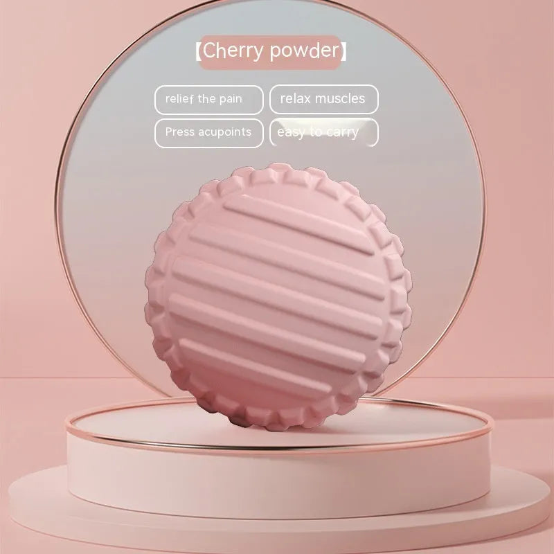 A 6cm diameter TPR foot massage ball shown in one of four colour options: pink, blue, green, or purple.
