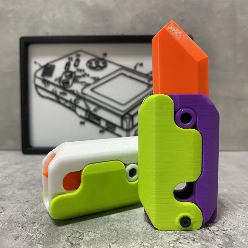 Carrot-shaped 3D printed plastic gravity fidget knife with orange purple green colour scheme