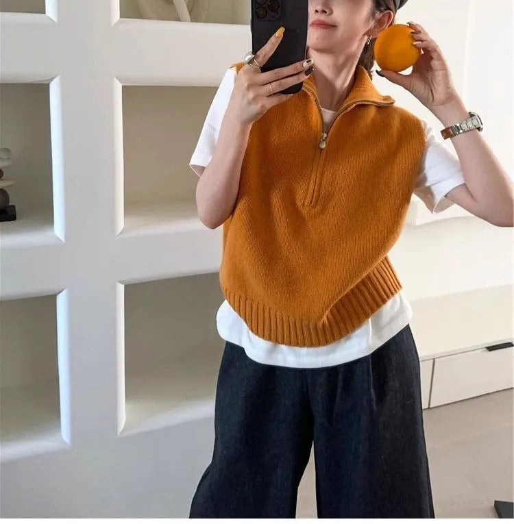 Orange retro half zip sleeveless mesh knit vest with 3D pattern showing front view
