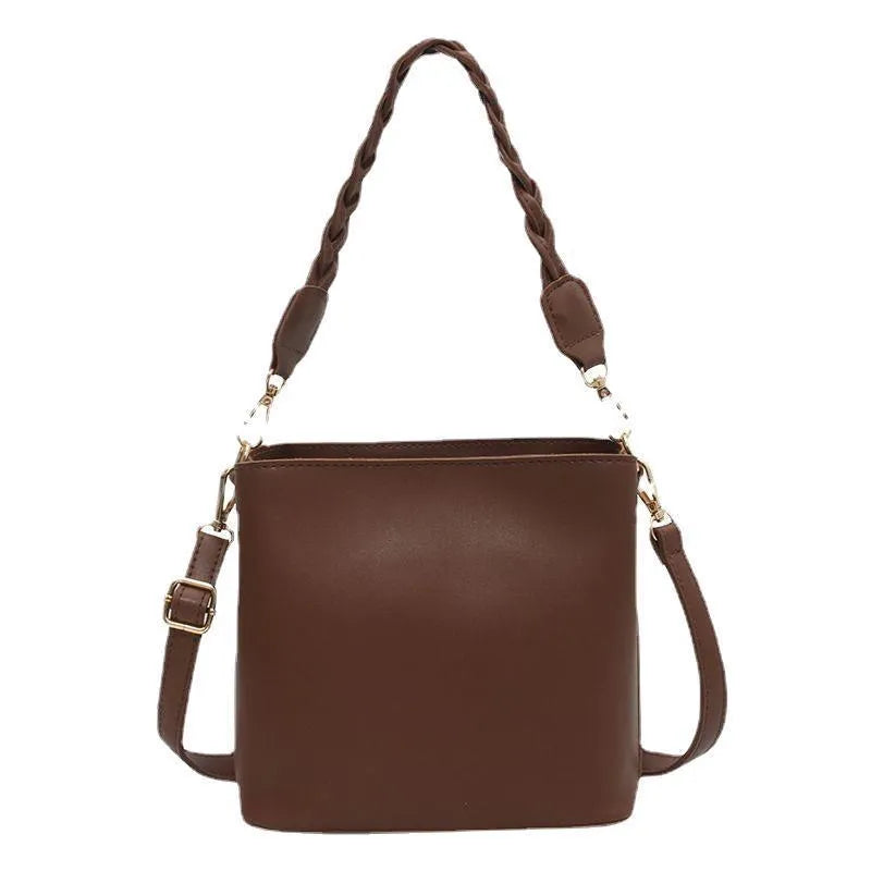 Retro woven one-shoulder crossbody bucket bag in khaki colour.