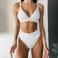 Grey women's embroidered bikini set with contrast binding, sleeveless top and shorts.