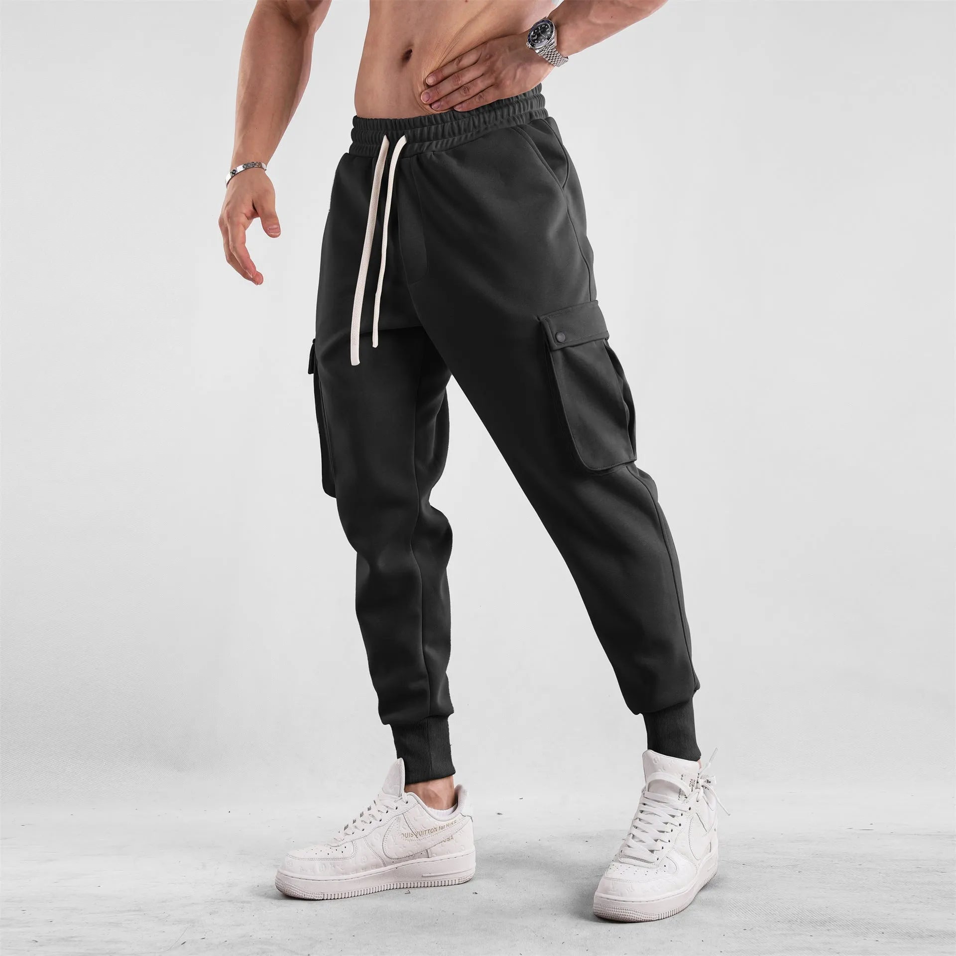 Men's loose cotton sports trousers with ankle ties and multiple pockets in various colour options