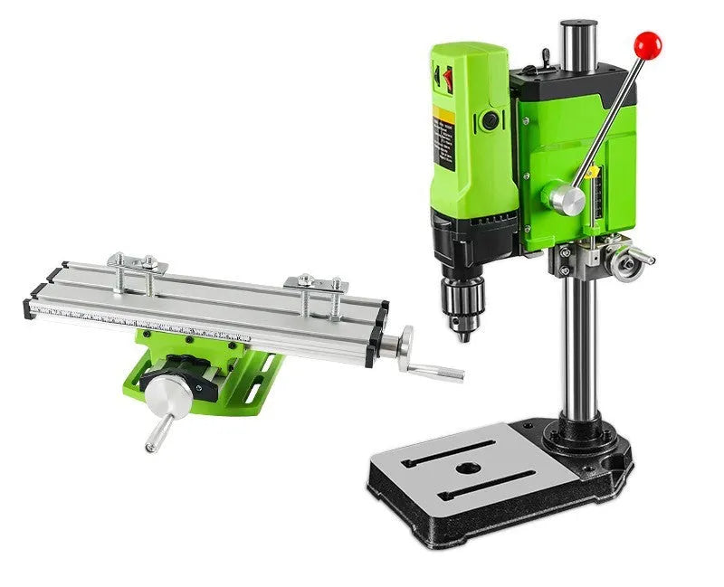 Mini bench drill and milling machine on a workbench with cross bench pliers and heavy-duty pliers.