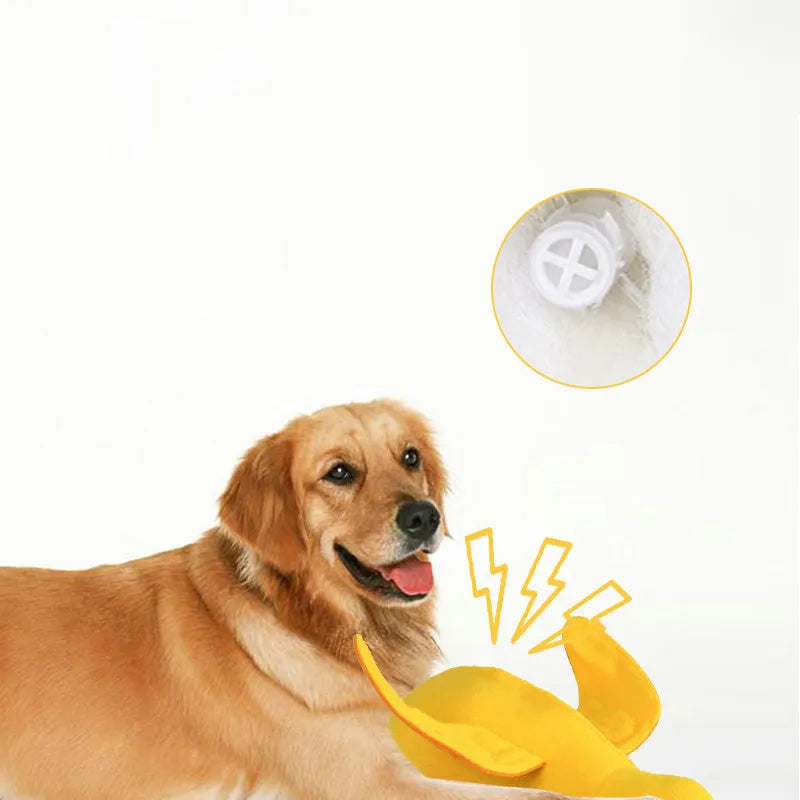 Yellow plush teddy dog toy with internal squeaky duck for training and food leak feature