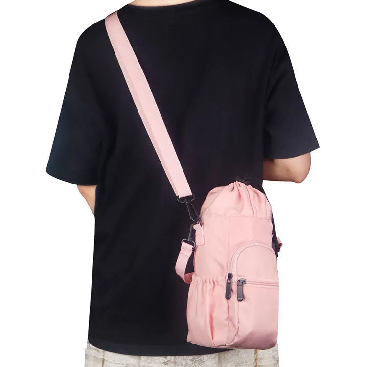 Cloth water bottle shoulder pouch in black, green, or pink with adjustable strap.