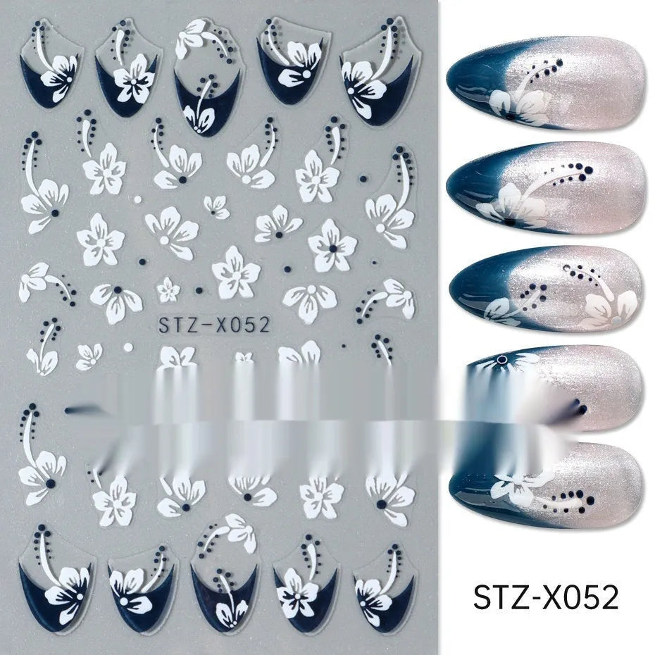 Pack of black and silver strip nail art stickers with cartoon and love pattern designs.