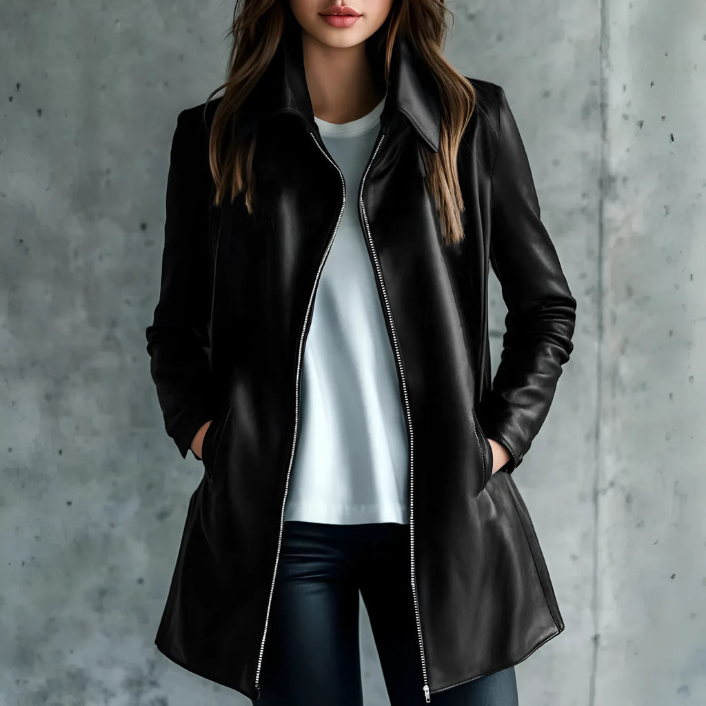 Black polyester women's leather jacket with long sleeves on a hanger.