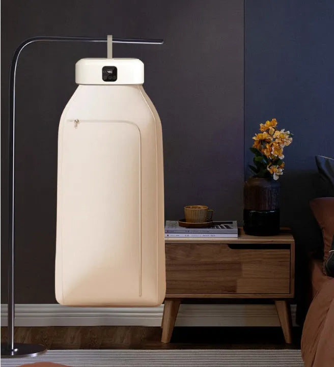 White cylindrical compact laundry dryer with remote control for dormitory use
