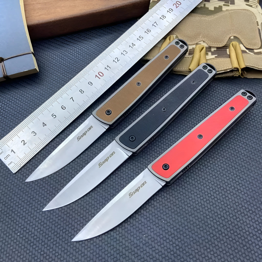Closed and open views of a folding fruit knife with stainless steel blade in black, brown, or red handle options.
