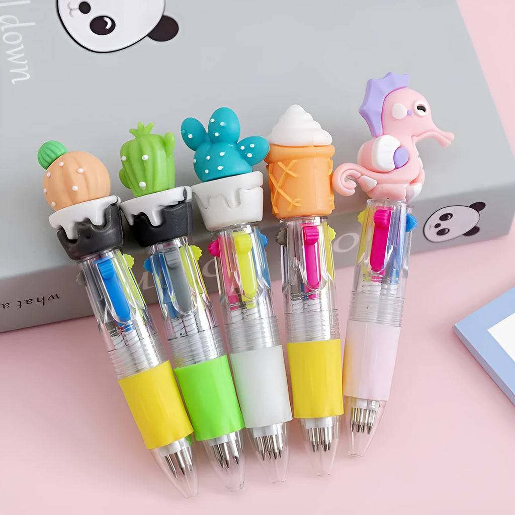 Cute cartoon four-colour press ballpoint pen with silicone grip and 0.7mm tip on a notepad.