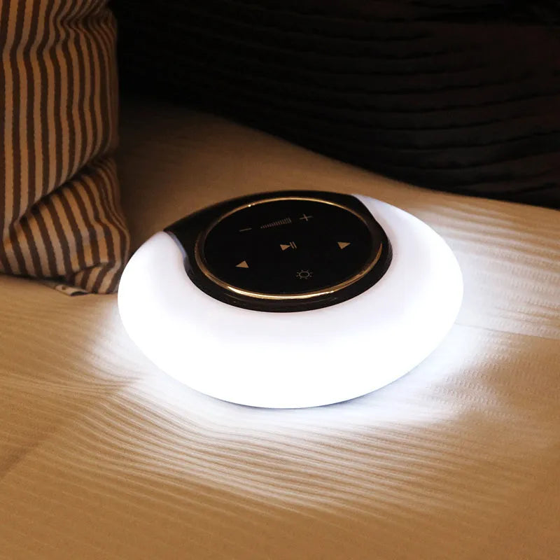 Bluetooth desk lamp with speaker showing folding design, touch controls, and LED lighting in plastic housing