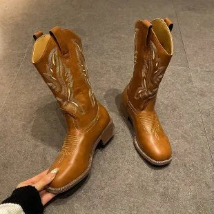 Brown women's Martin boots with embroidered pattern and mid-calf length, showing low square heel and round toe