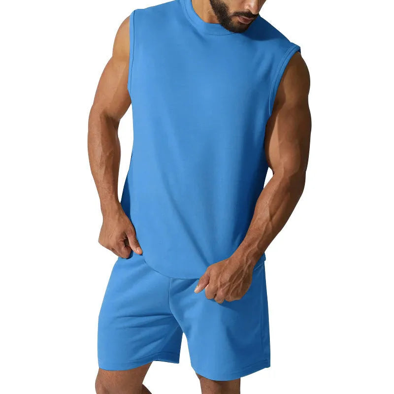 Men's sleeveless cotton blend sports suit showing sleeveless top and matching shorts in a solid colour.