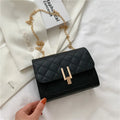 Women's diamond lattice chain crossbody bag in black with adjustable strap
