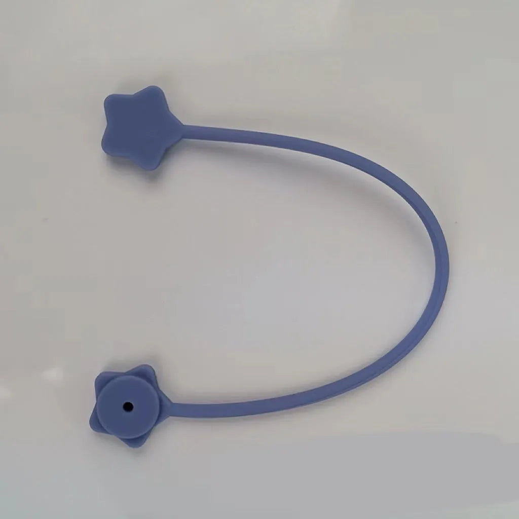 Small star-shaped silicone magnetic wire winder in various colours for organising headphone and computer cables.