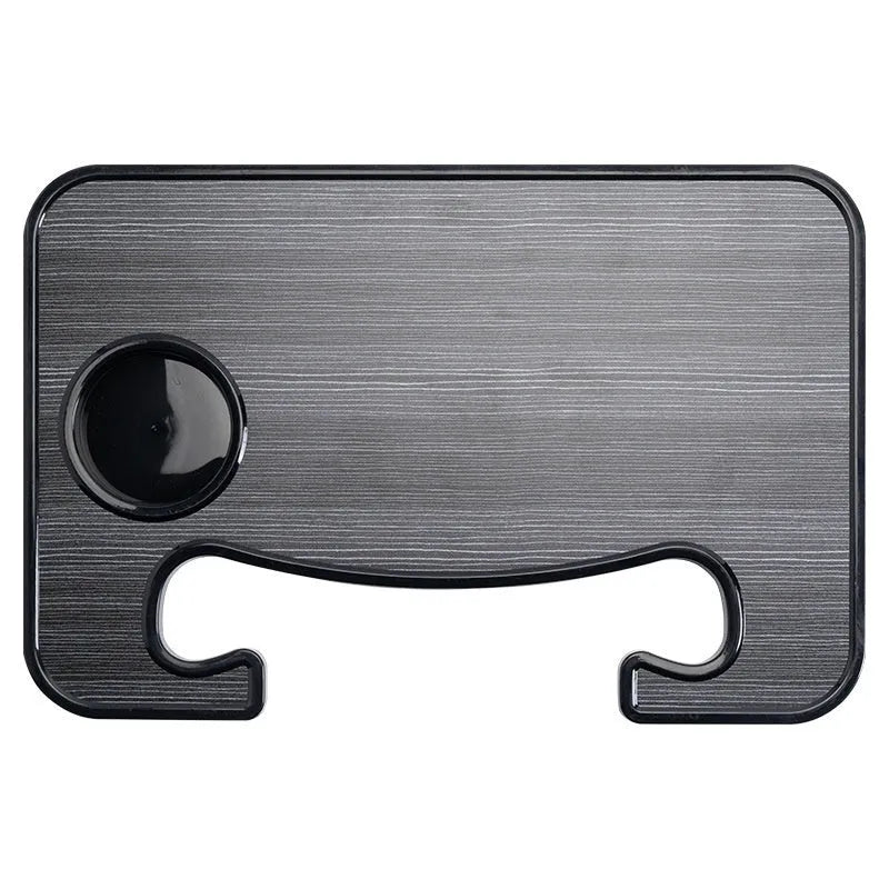 Black ABS plastic car steering wheel laptop stand with foldable cup holder on a grey steering wheel