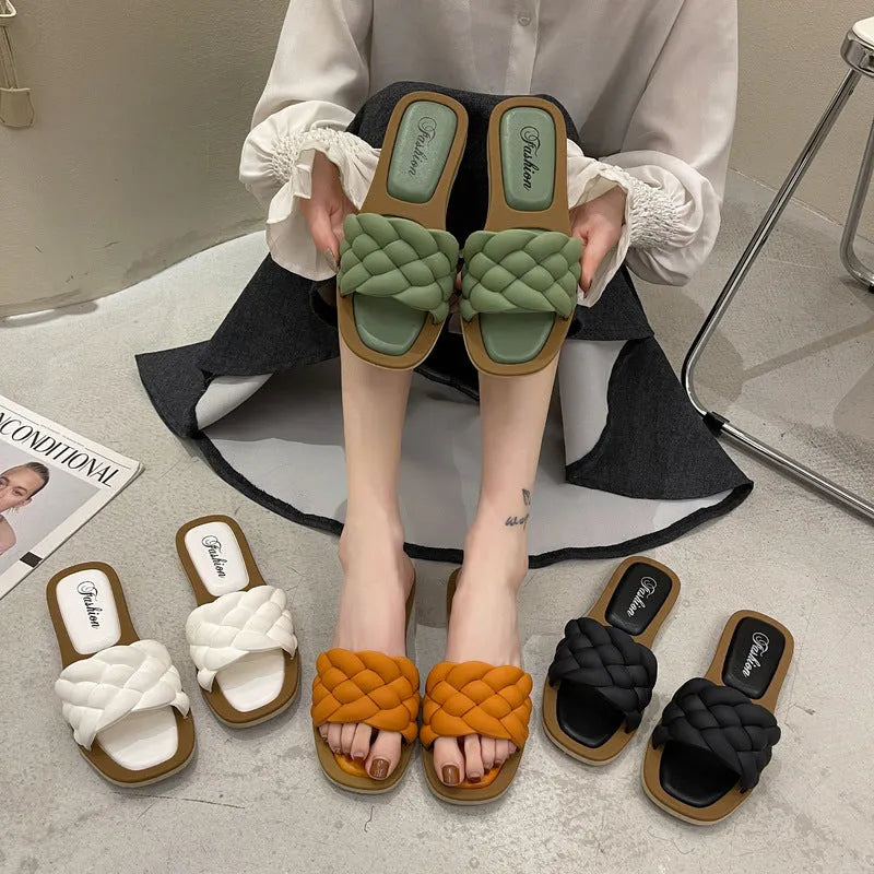 Women's plaid PVC beach sandals with thick anti-skid soles in black, green, orange and white.