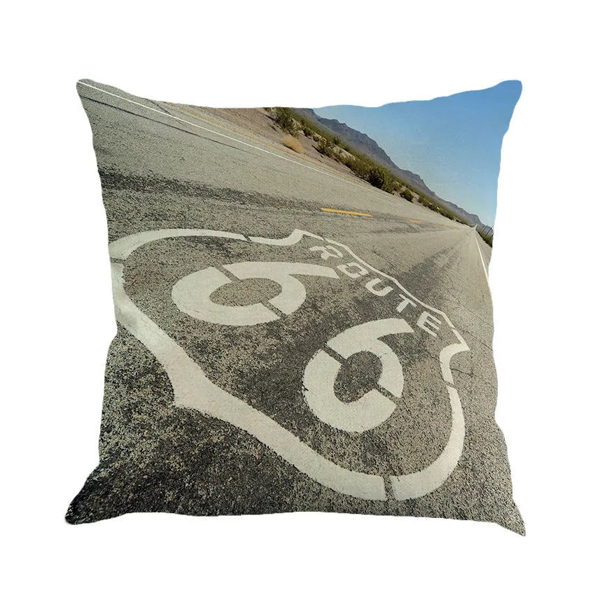 Linen cushion cover with US Route 66 scenic landscape print, shown in one of six available colours.