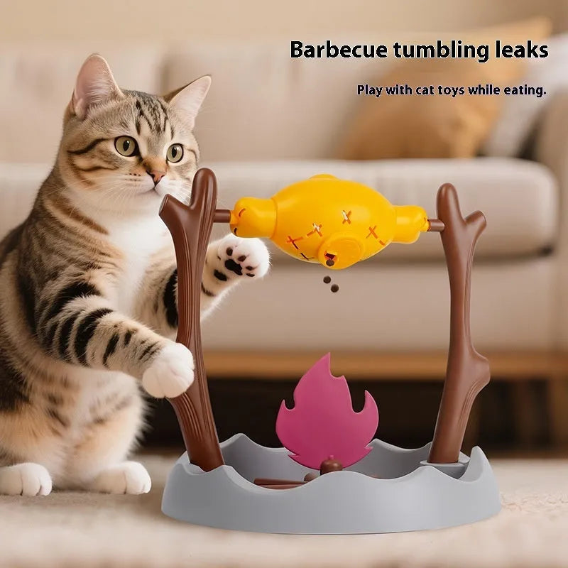 Tumbling barbecue-style cat feeder toy with leakage food dispenser, shown in plastic construction.