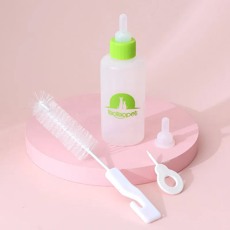 Set of four coloured pet milk bottles with a cleaning brush for feeding newborn puppies and kittens.