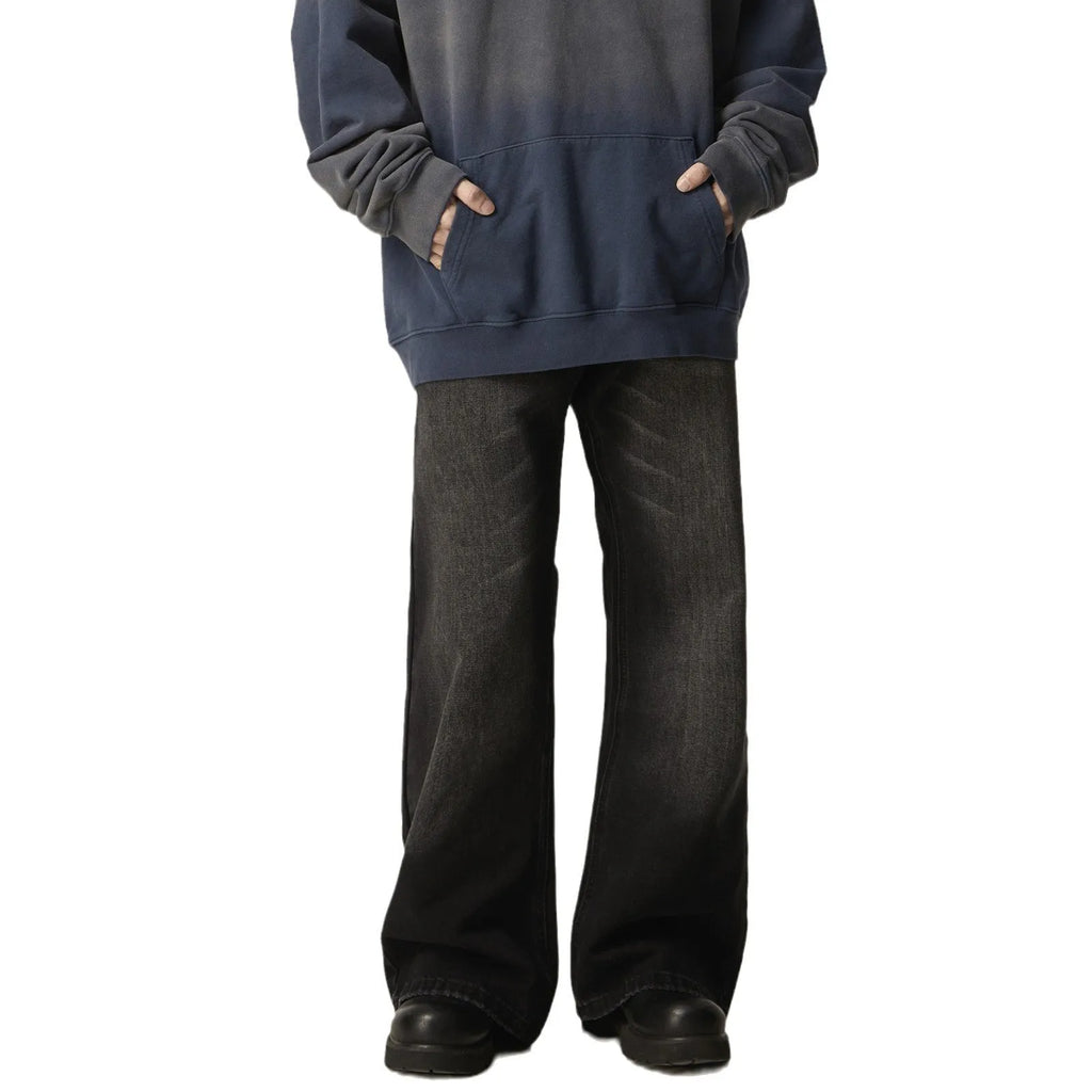 Black loose straight-leg retro jeans on a mannequin, showing zipper fly and relaxed fit.