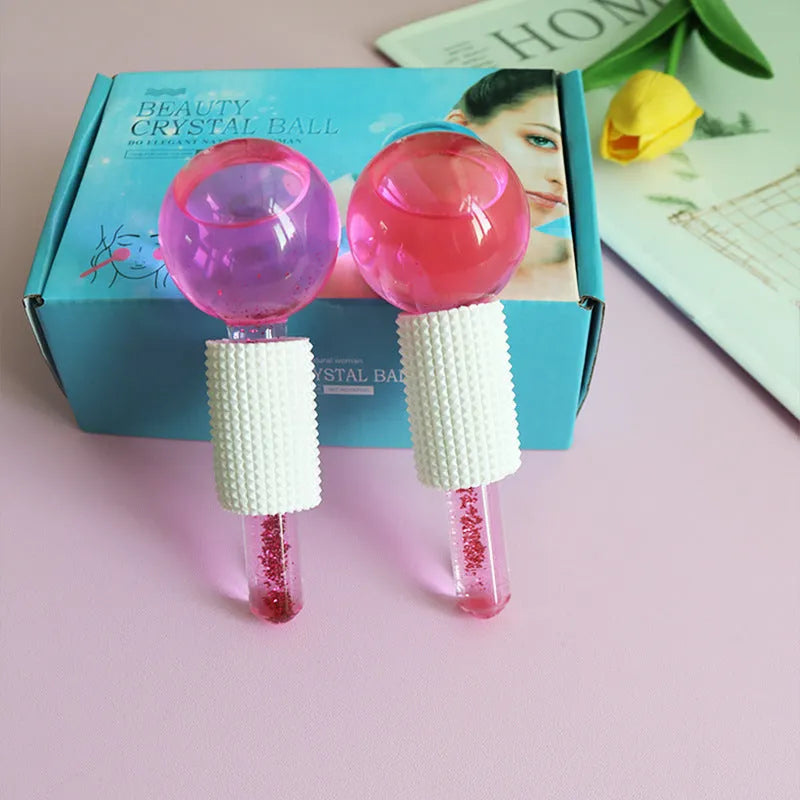 Set of two beauty ice wave ball face massage tools in purple flash finish on white background