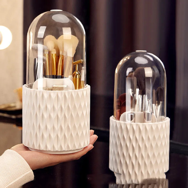 White rotating transparent makeup brush storage tube with dust cover lid on desktop