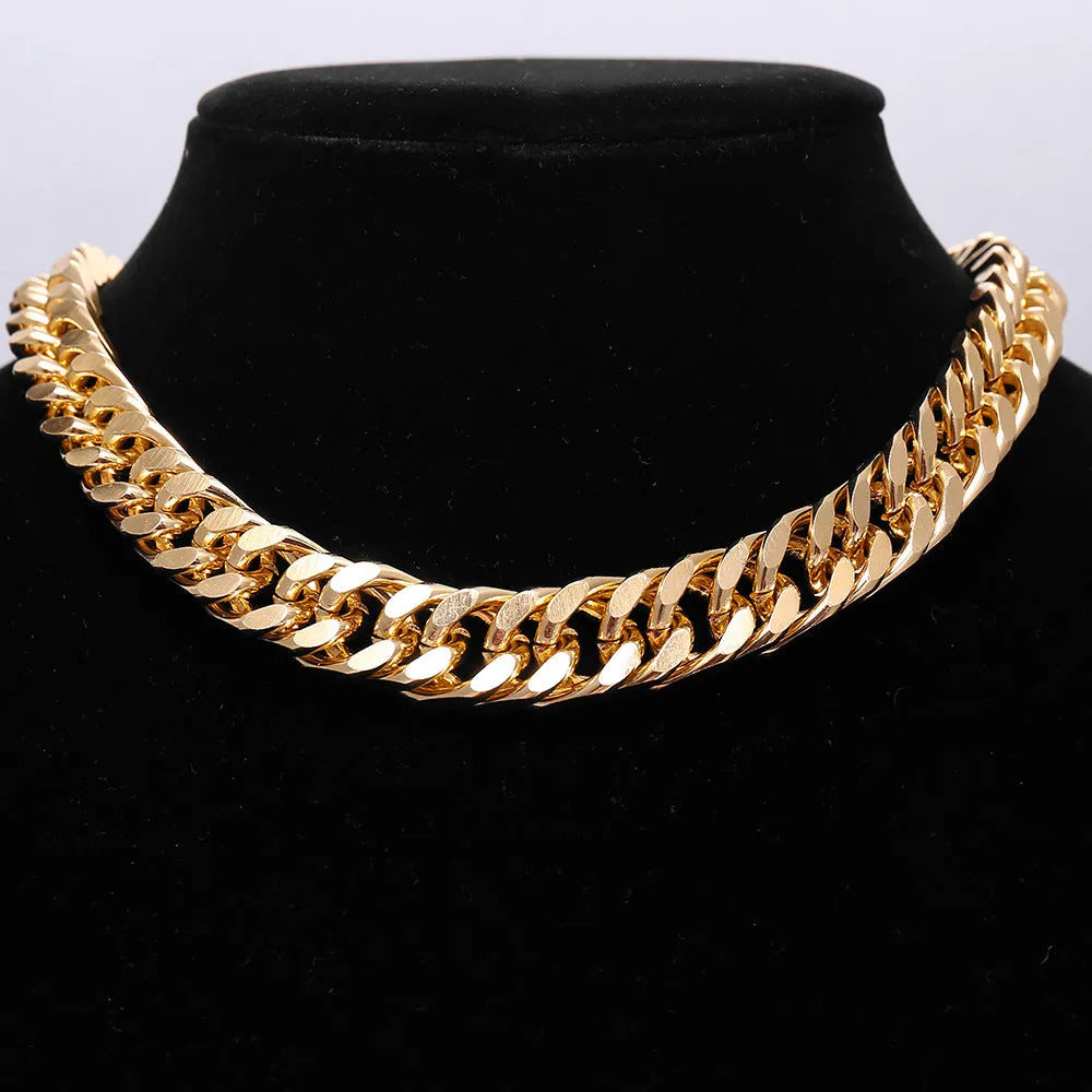 Women's gold coloured thick chain alloy necklace showing 32cm length and 6cm wide links.