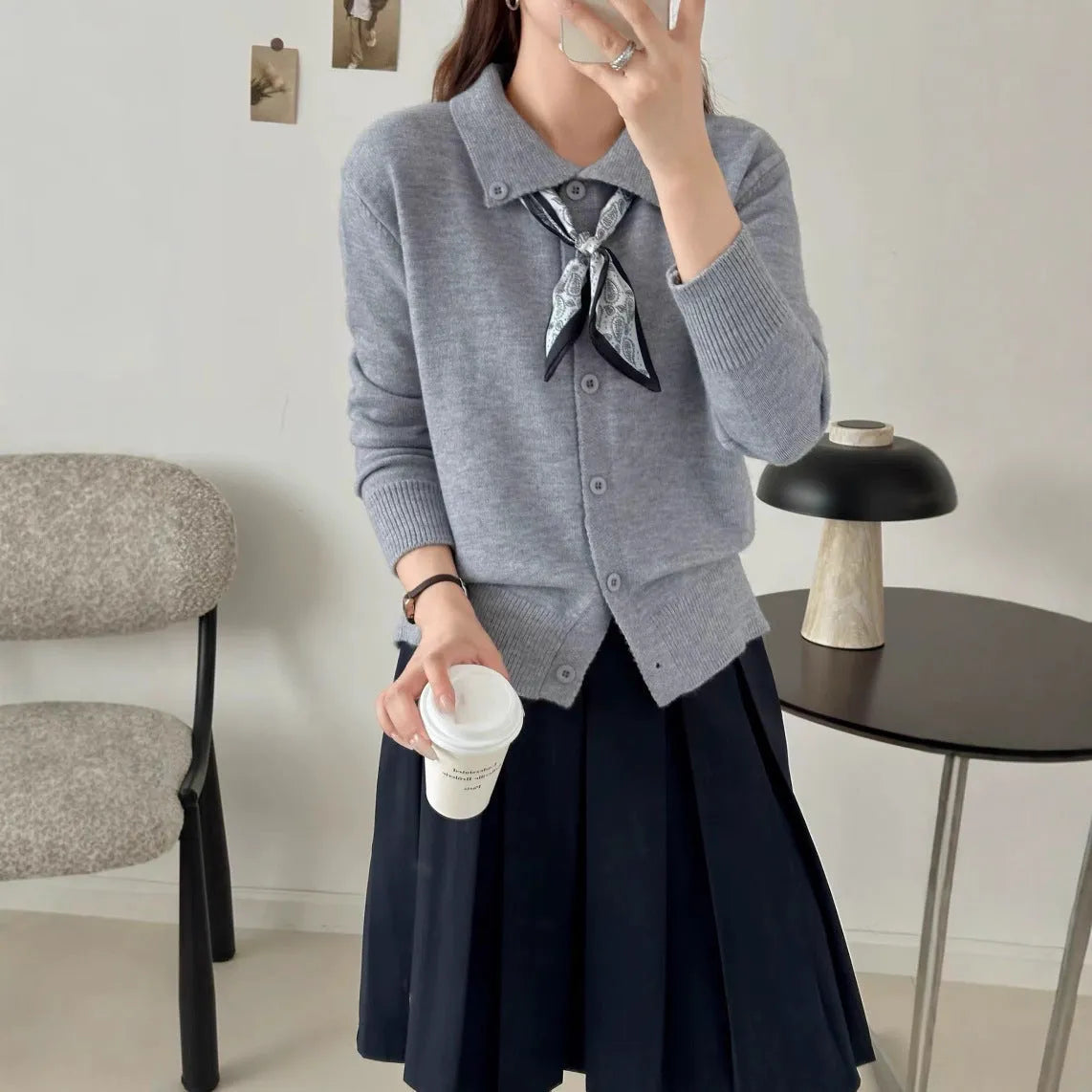 Women's milky white cardigan sweater with a built-in lapel scarf collar and long sleeves.
