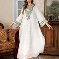 White traditional Dubai Arabic robe with long sleeves and floor-length design