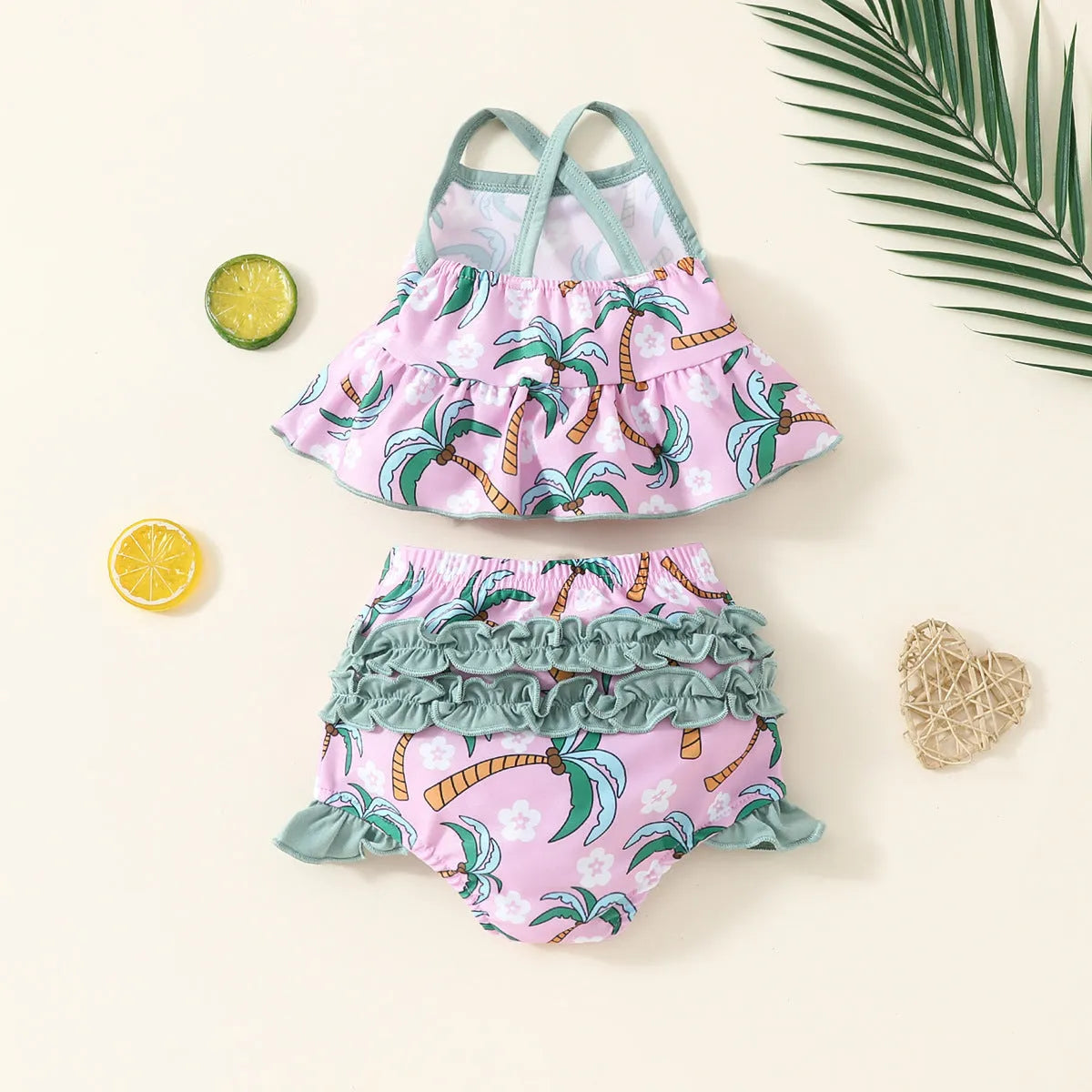 White children's two-piece swimsuit set with shirt and beach shorts on hanger