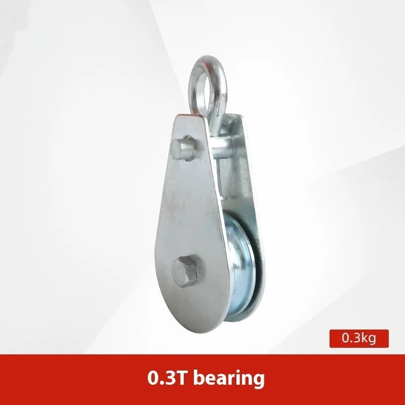 Red industrial steel lifting pulley with a safety latch on the hook.