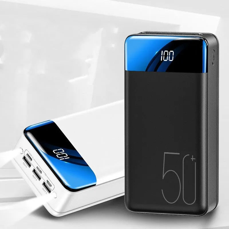 Black and white large capacity 50000mAh power bank with multiple USB ports for charging.