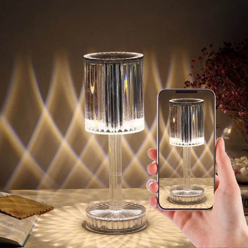 Amber K9 crystal table lamp with double-layered lampshade on a modern bedside table, warm LED light on medium brightness