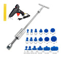Automotive dent repair tool kit with T-shaped metal hammer and blue adhesive tabs for car body panel restoration