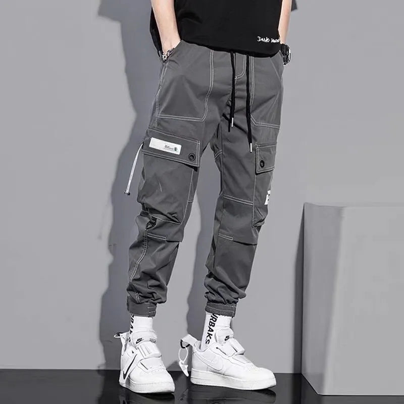 Men's loose fit polyester solid colour trousers in black or gray, autumn casual style, size S to 5XL