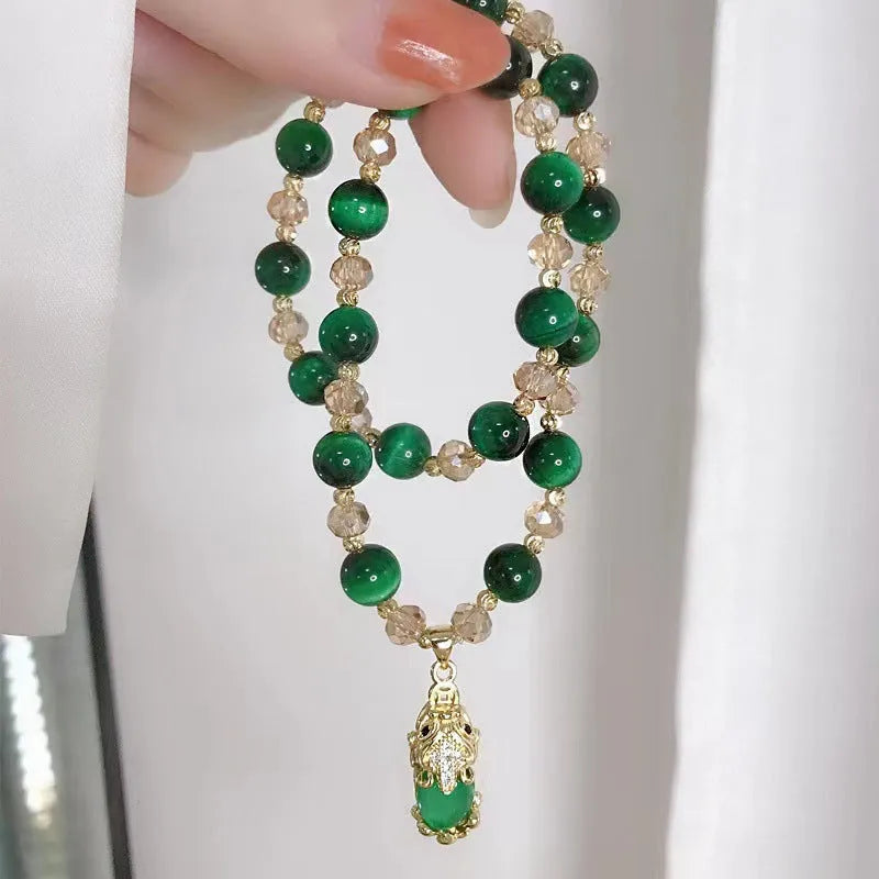 Handmade natural Vanves stone Tigereye bracelet on wrist showing single or double chain with fox motif.