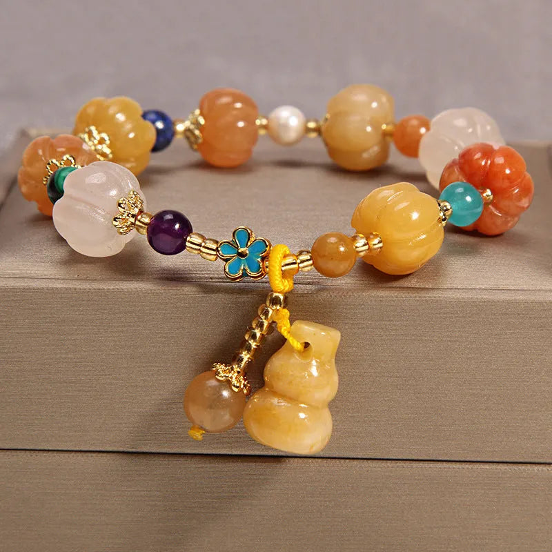 Natural garnet multi-layer crystal bracelet with strawberry quartz, moonstone, and pendant details in Korean light luxury style