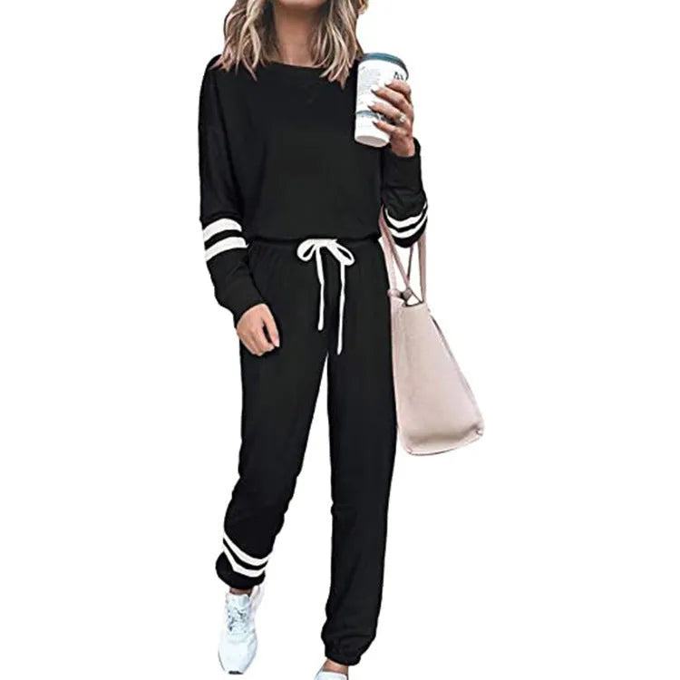 Women's plus size loose-fitting casual suit set in a solid colour, featuring a half-sleeve top and trousers.