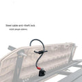 Plastic-sheathed steel cable lock for roof platforms shown securing a kayak.