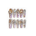 False nail patches with rhinestone detail on card paper packaging showing S number sizing