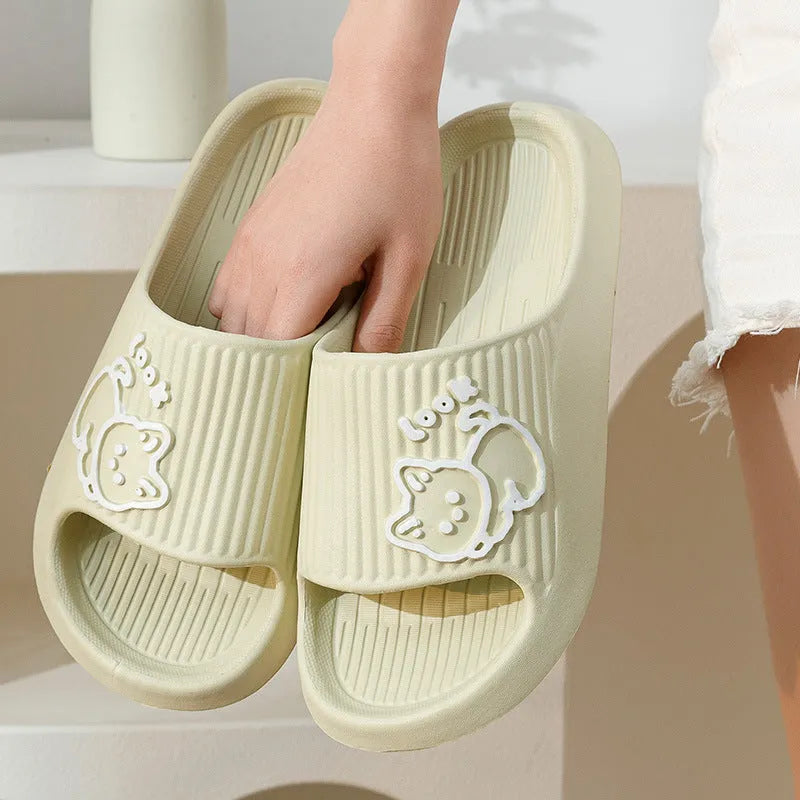 Women's pink cat-themed flip-flop slippers with a thick light blue EVA platform sole.