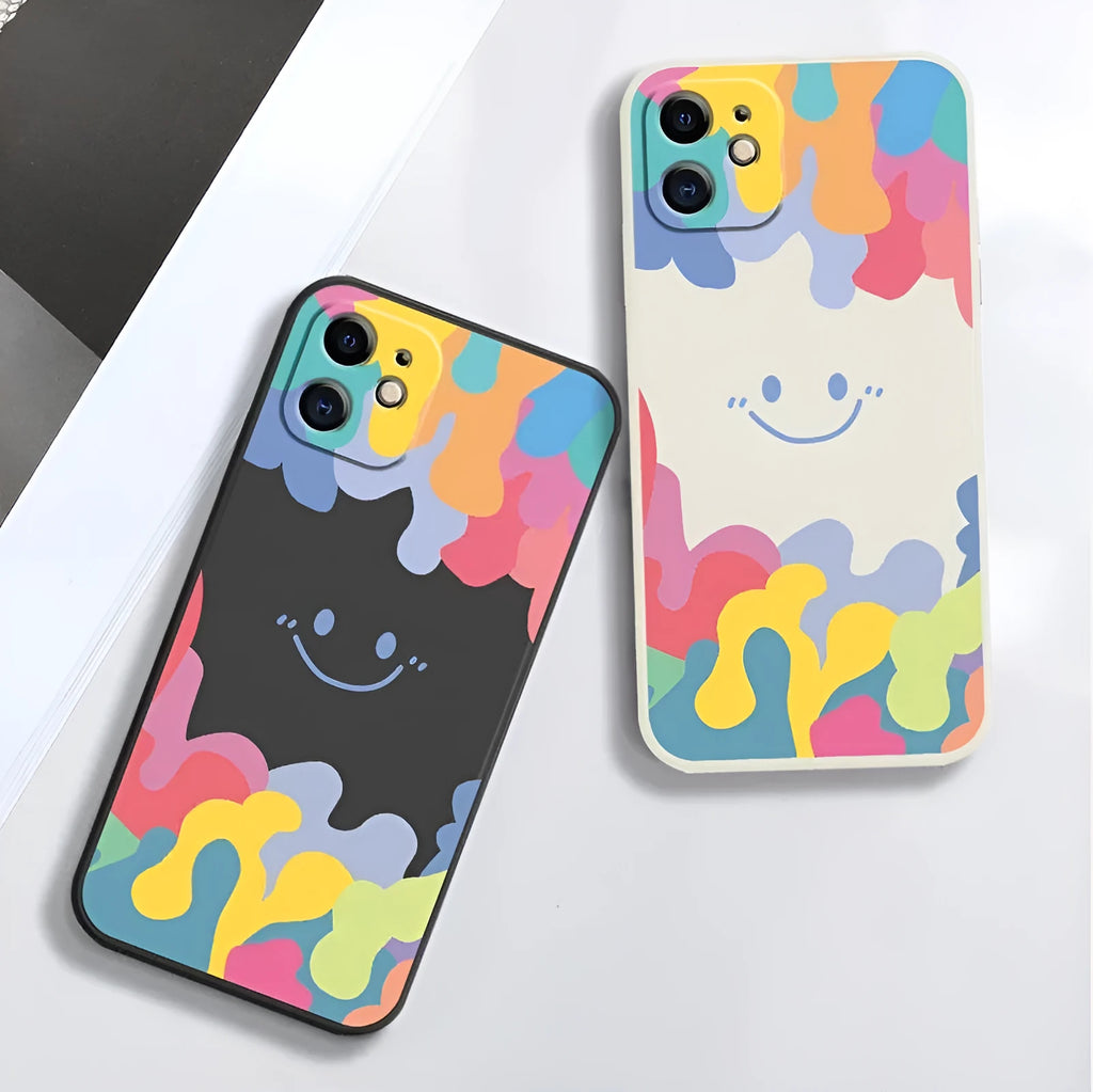 White silicone iPhone case with rainbow smiley face design and attached lanyard