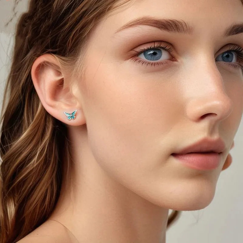 925 sterling silver blue butterfly small ear studs for women with dripping oil colour finish on white background