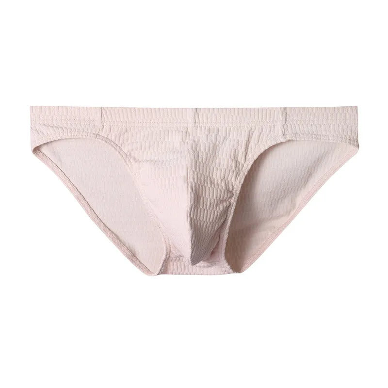 Men's solid colour cotton triangle briefs in apricot, shown from the front on a mid-waist fit model.